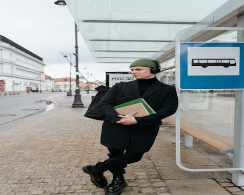 Someone standing relaxed while waiting for public transport